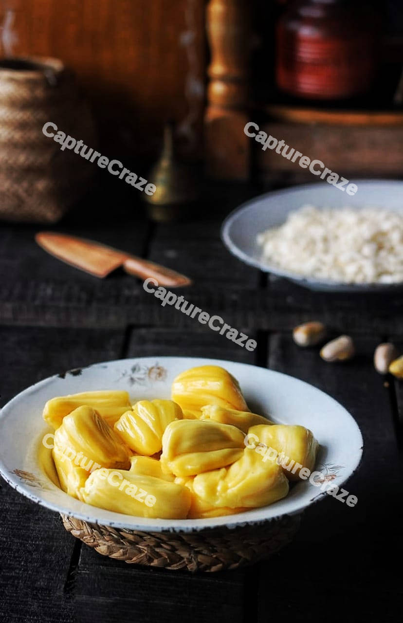 Fresh jackfruit slices on a white plate